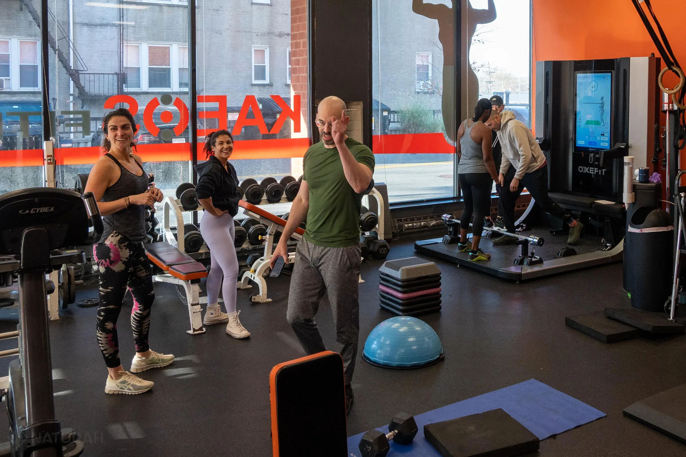 Clients and coaches training together on the Kaeos studio floor